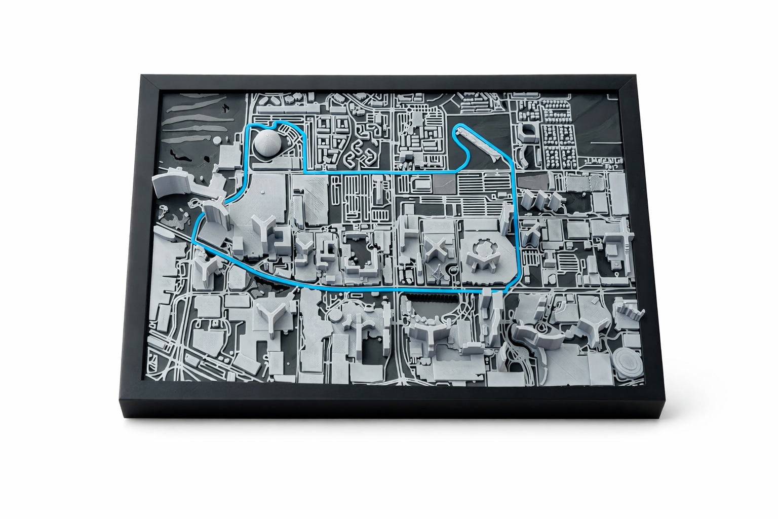 Framed city map with blue track lines on a white background